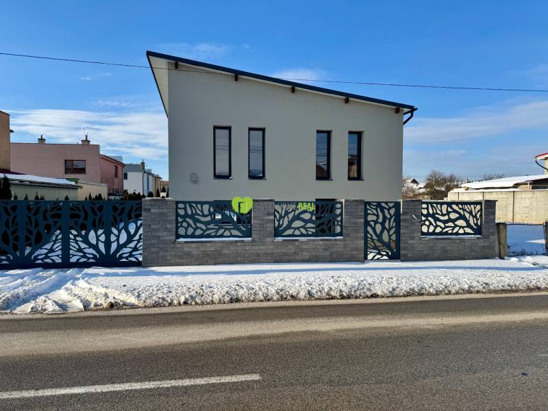 A family house on Gyňovská Street in Čaňa with an interesting fence and a snowy surroundings.