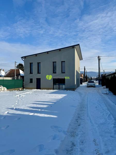 A family house on the snowy Gyňovská street in Čaňa with modern architecture.