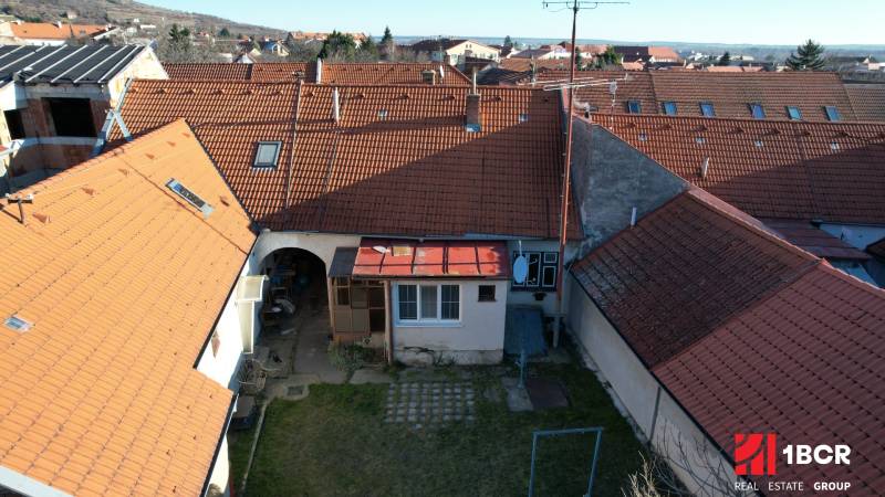 A family house on Bratislavská in Svätý Jur with a courtyard and red roofs.