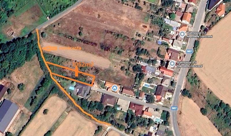 Aerial view of residential plots in Ratnovce, surrounded by greenery and houses.