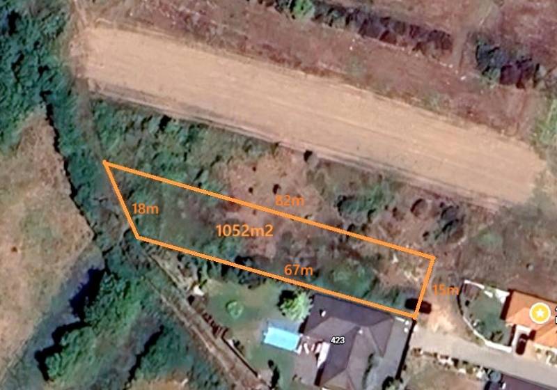 Aerial view of a residential plot in Ratnovce with a marked area of 1052 m².