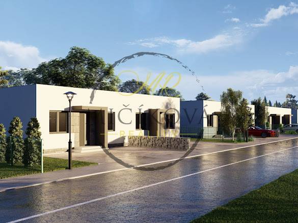 A family house on Veľké Janíkovce Street in Nitra with a garden and a driveway.