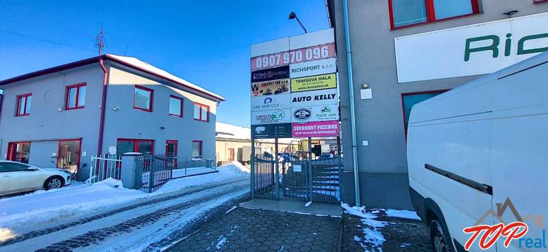 Buildings and billboards on Osloboditeľov Street, Košice - Barca district, Offices.