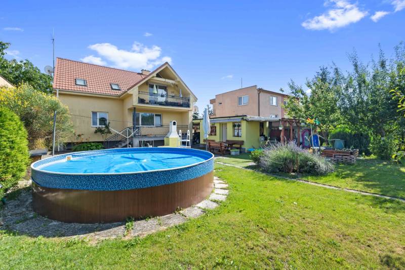 A family house on Tehelná Street in Sereď with a swimming pool and garden seating.