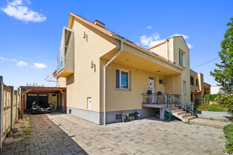 A family house on Tehelná Street in Sereď with a shelter and a garden.