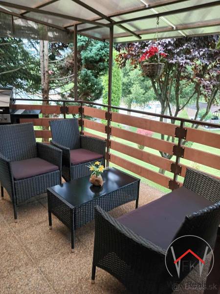Furnished terrace with rattan seating by residential plots in Jasenovce in Jesenovce.