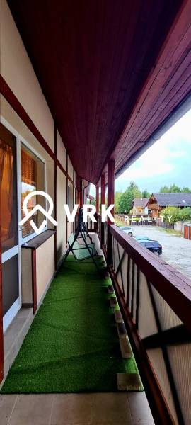 A balcony with artificial grass and a swing, facing Veľký Slavkov, Horný Slávkov.