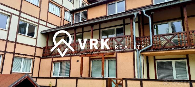 An apartment building on Horný Slávkov Street in Veľký Slavkov with wooden elements on the facade.