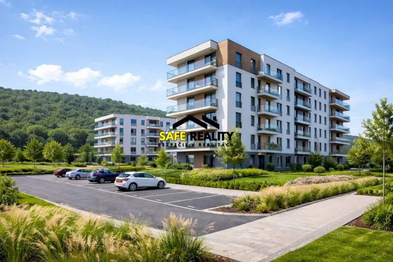 A new building with balconies and parking in Bytča, surrounded by natural scenery.