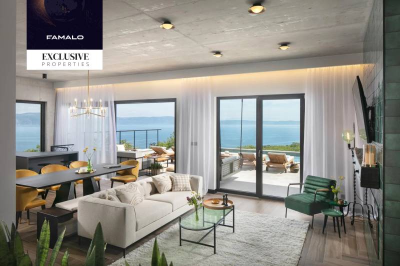 The villa with a wooden decor floor offers a cozy space with a sea view.