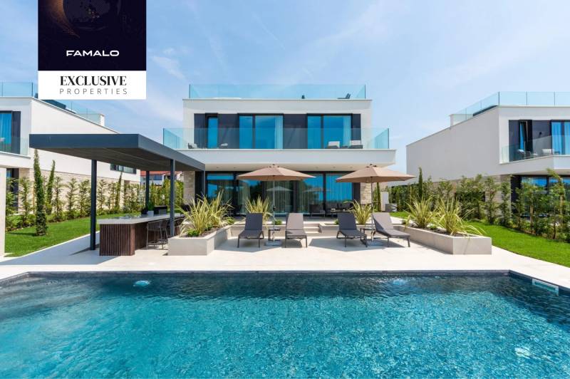 Villa in Kukciach with a pool, loungers, and a garden, ideal for relaxation.