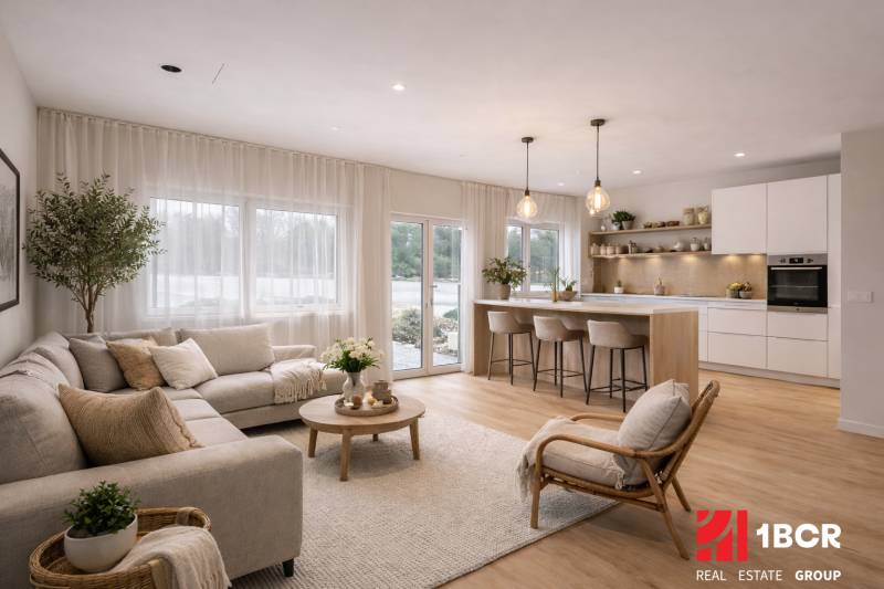 Living room and kitchen in a family house with a wooden decor floor, comfortable furniture.