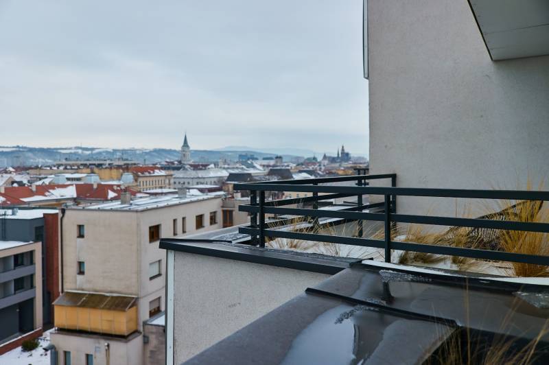 View of the roofs of Košice from the balcony of an apartment building on Strojárenská Street.