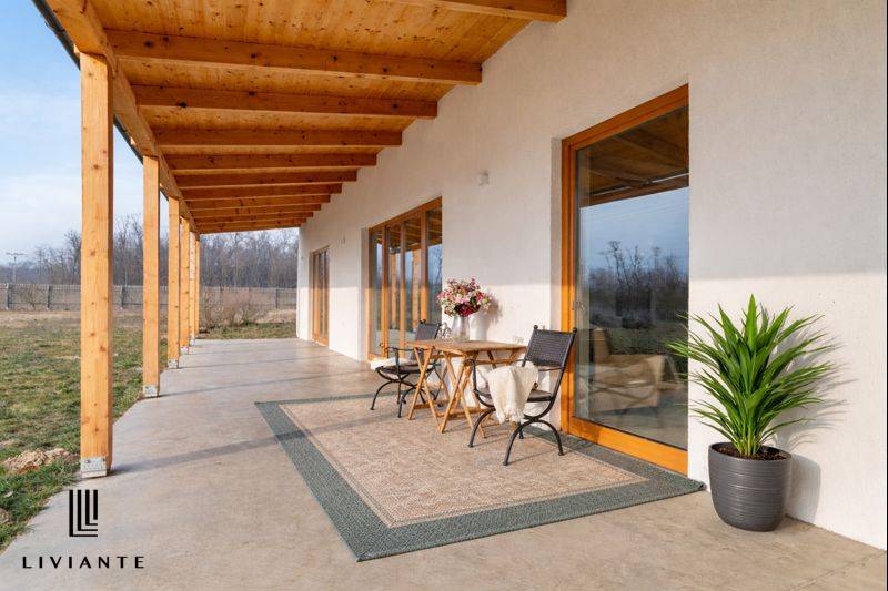The terrace of the building in Lábe on Lábska Street, with seating and greenery.