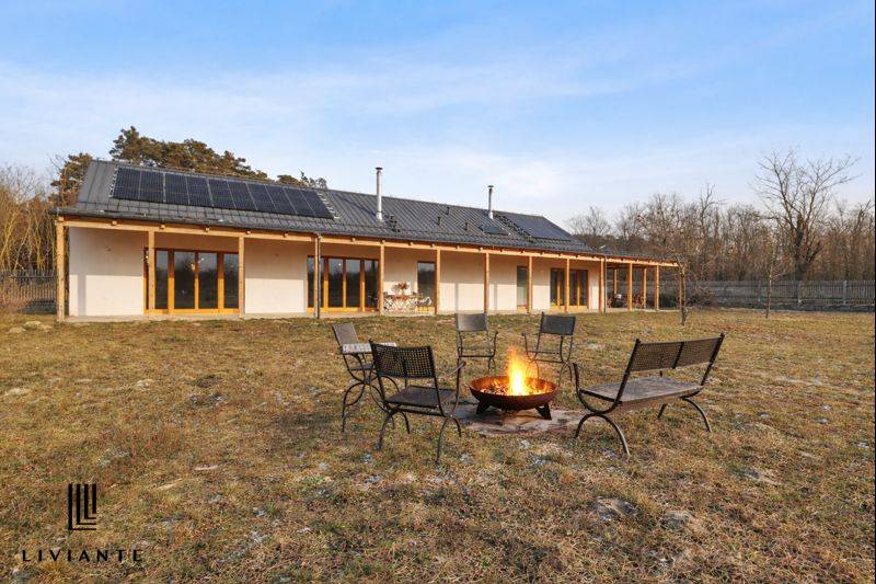 A building on Láb Street in Láb with a terrace and a fire pit in the yard.