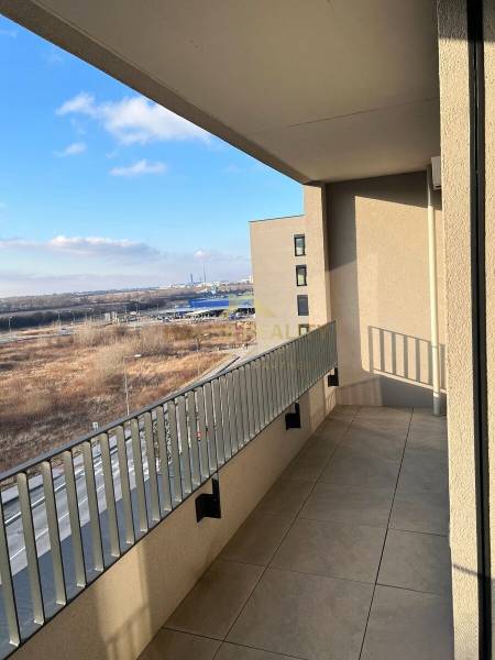 A balcony with a view of the surroundings of Bratislava - Devínska Nová Ves on Mateja Encingera Street.