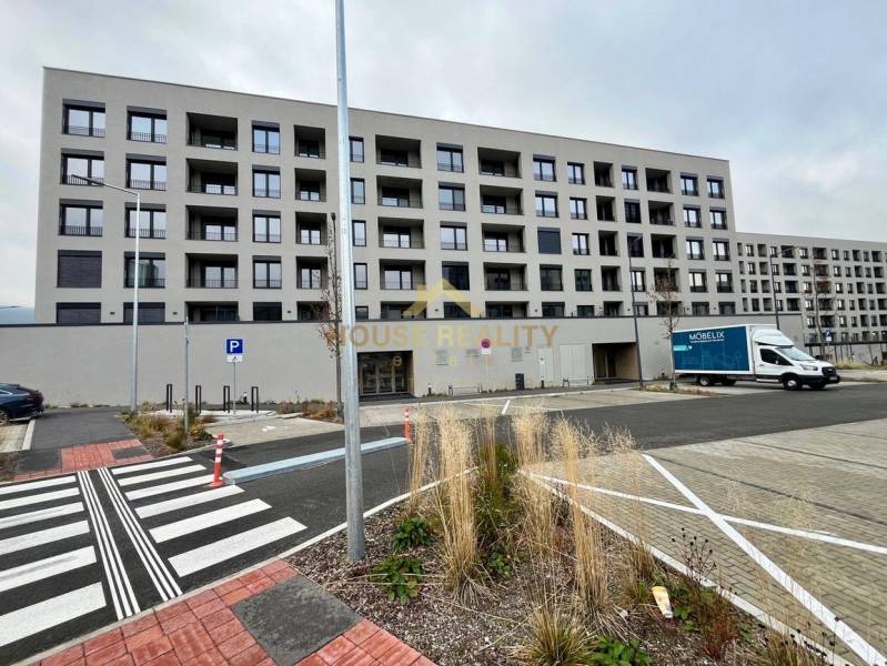 A modern six-story building on Mateja Encingera Street in Devínska Nová Ves, Bratislava.