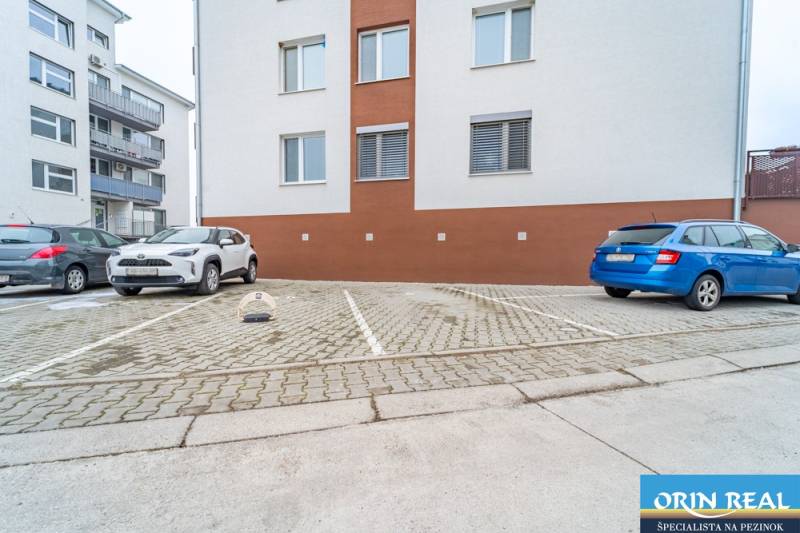 Parking spaces at the apartment building on Slavomírova Street in Slovenský Grob.