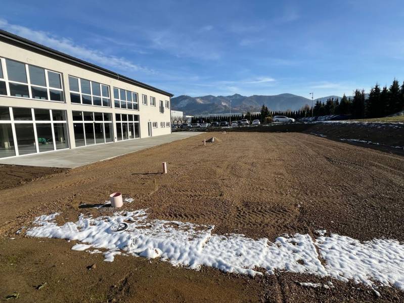 Commercial premises in Strečno on SNP Street with mountains in the background.
