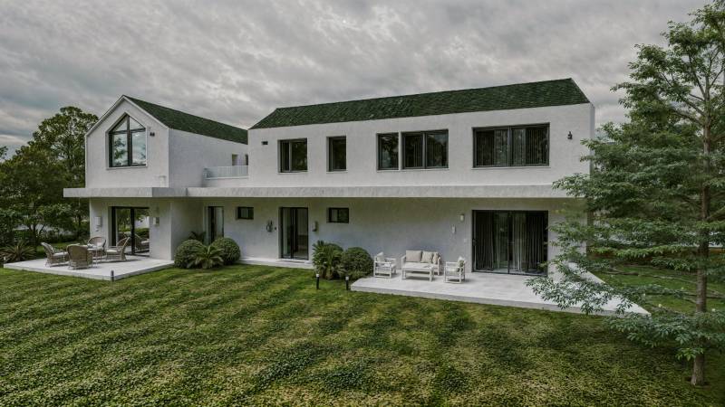 In Mlynica, a family house with a spacious terrace surrounded by greenery and trees.