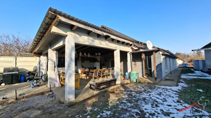 Family house in Žitavce with a terrace on Žitavce Street and seating by the garden.