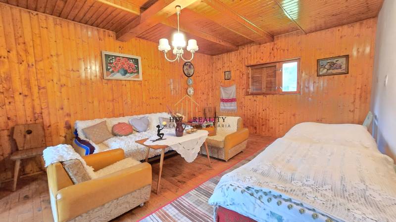 Wooden walls, furniture, and decorations in the interior of the family house create a cozy atmosphere.