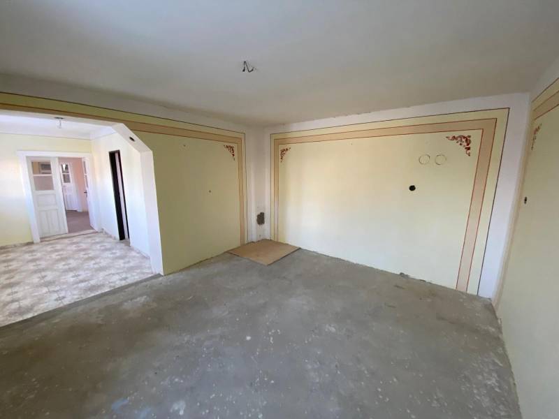 In a family house with white doors and decorative walls.