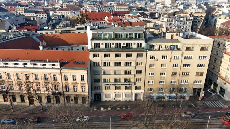 The building on Vajanského Embankment in Bratislava, surrounded by historical architecture in the Old Town.