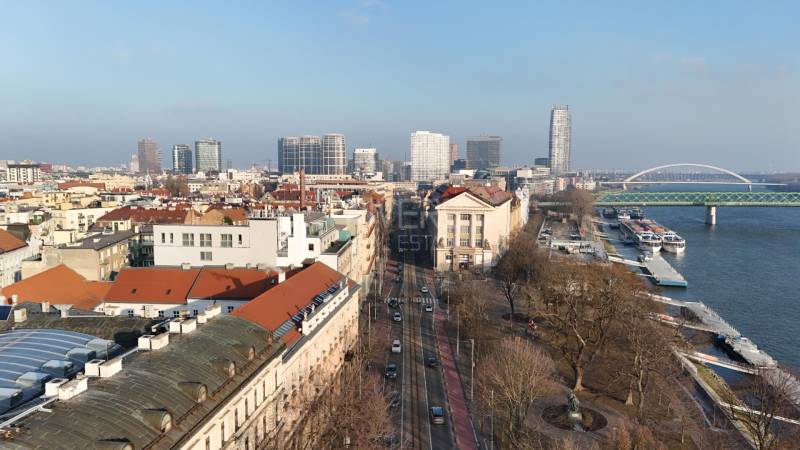 Vajanského Embankment in the Old Town of Bratislava with a view of the river and buildings.