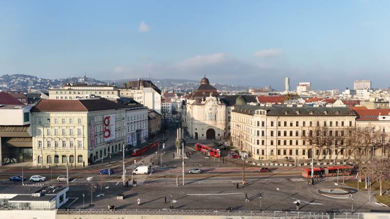 A view of Bratislava with historical architecture and busy traffic on Vajanského Embankment.