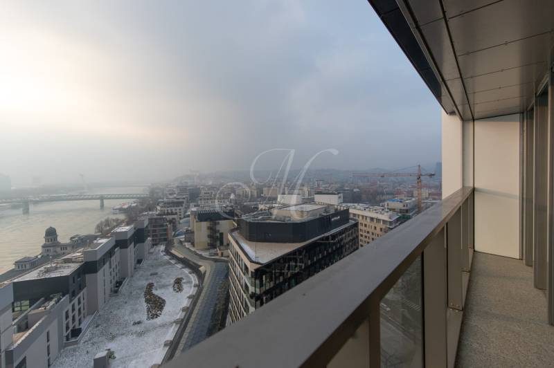 View from the balcony of snow-covered roofs and a bridge in Bratislava - Old Town.