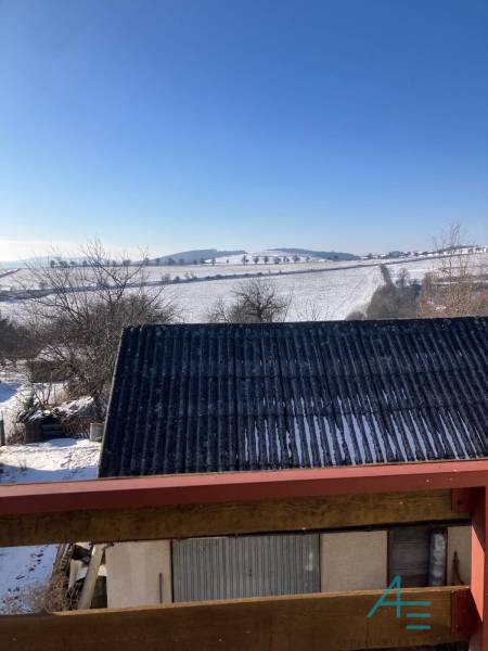 Snowy landscape in the town of Rudník from a family house on Rudník Street.