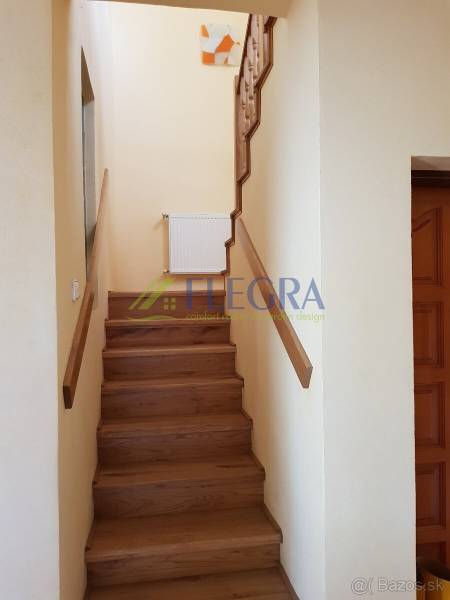 A staircase with a wooden decor floor in a family house.