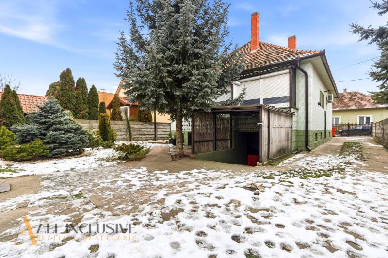 Family house on Čečínská Potôň in Orechová Potôň with a landscaped garden and a snow-covered yard.