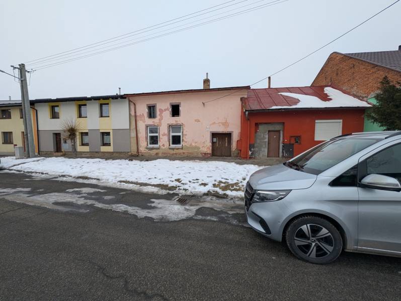 Family houses on Remeselnícka Street in Ľubica during the winter season with a snow cover.