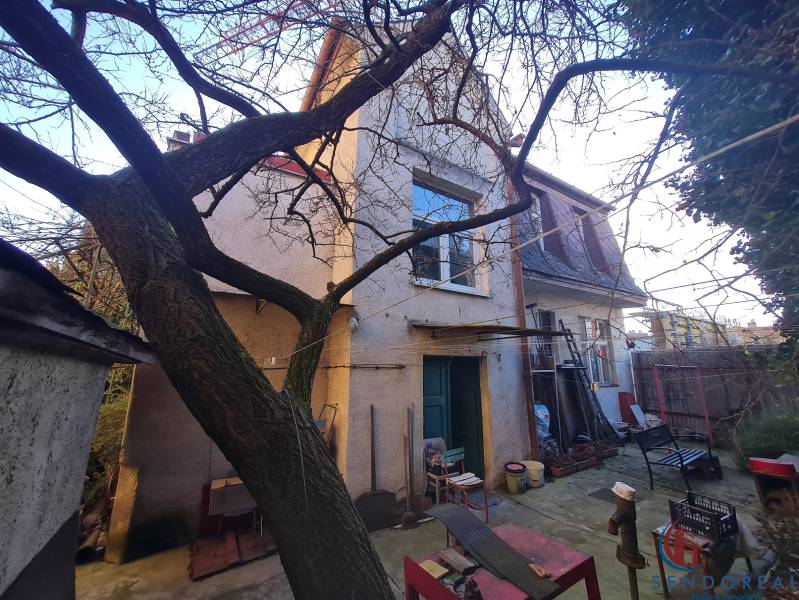 A family house on Štúrova Street in Piešťany with a yard and trees in the background.
