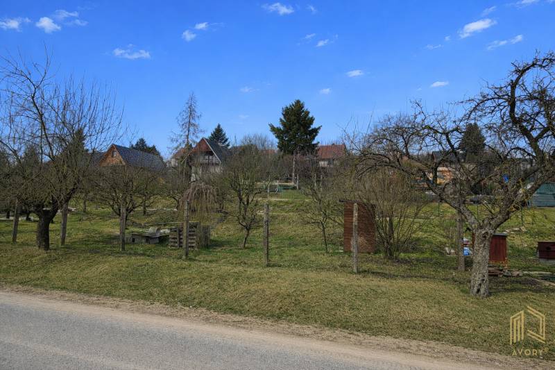 Gardens in Osuské on Opendáky with fruit trees and country cottages.