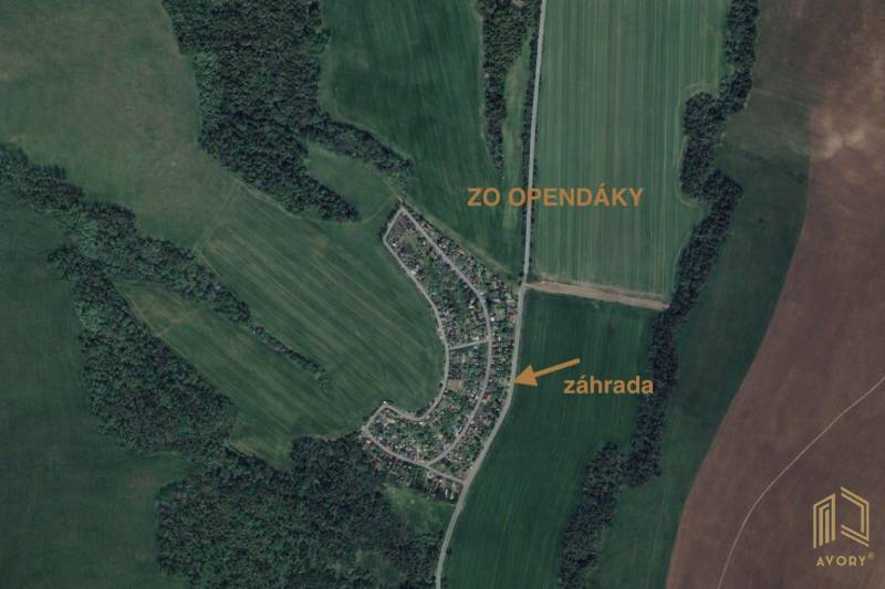 Aerial view of gardens in Osuské on Opendáky Street, surrounded by fields and forests.