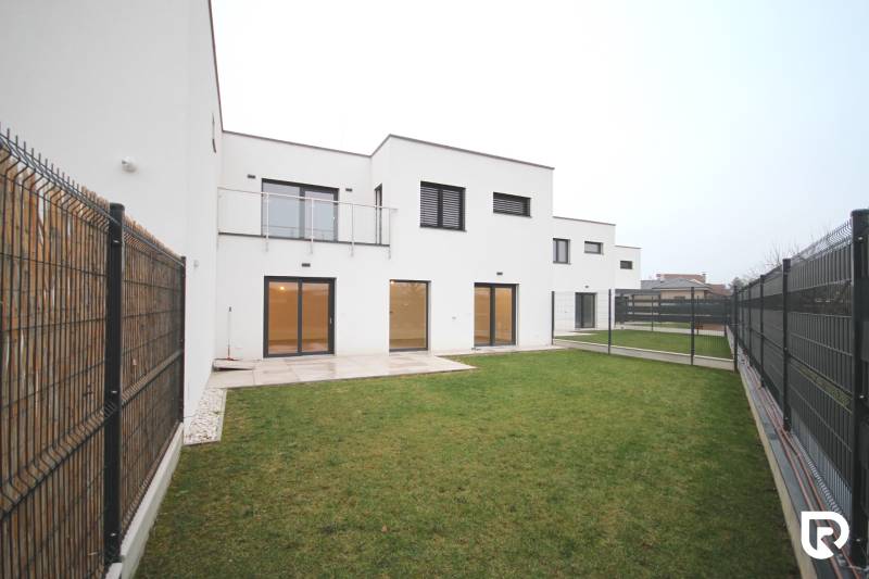 A family house on Legionárska Street in Trenčín with a lawn and fencing.