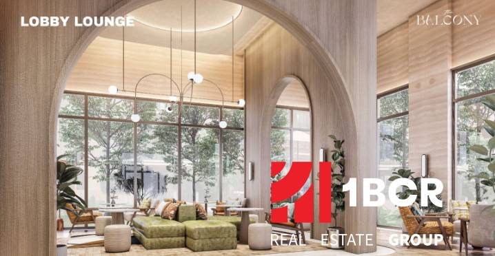 Modern lobby space with large arched windows and comfortable seating. Apartment construction.