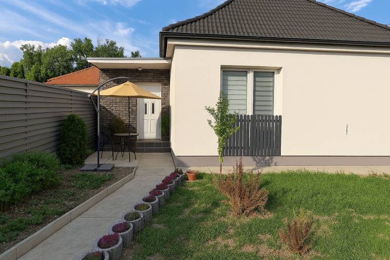 A family house in Horné Saliby with a terrace, fence, and well-maintained garden.