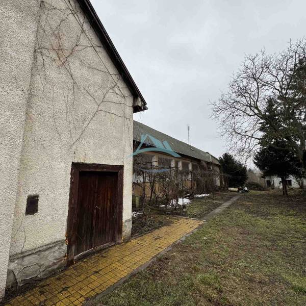 A family house on SNP Street in Šahy with an older exterior and a gravel pathway.