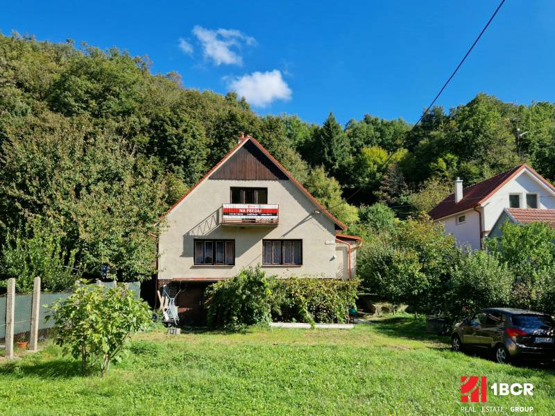 Family house for sale in Podhradie, Svätý Jur, surrounded by greenery and orchards.