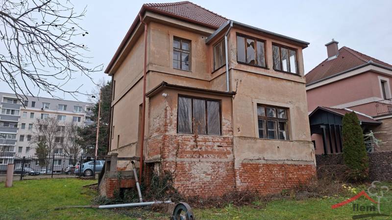 A family house on Levická Street in Vráble with plaster and a brick foundation.