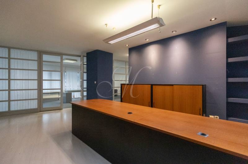 Office room with a reception and a glass partition wall in a 4-room apartment.
