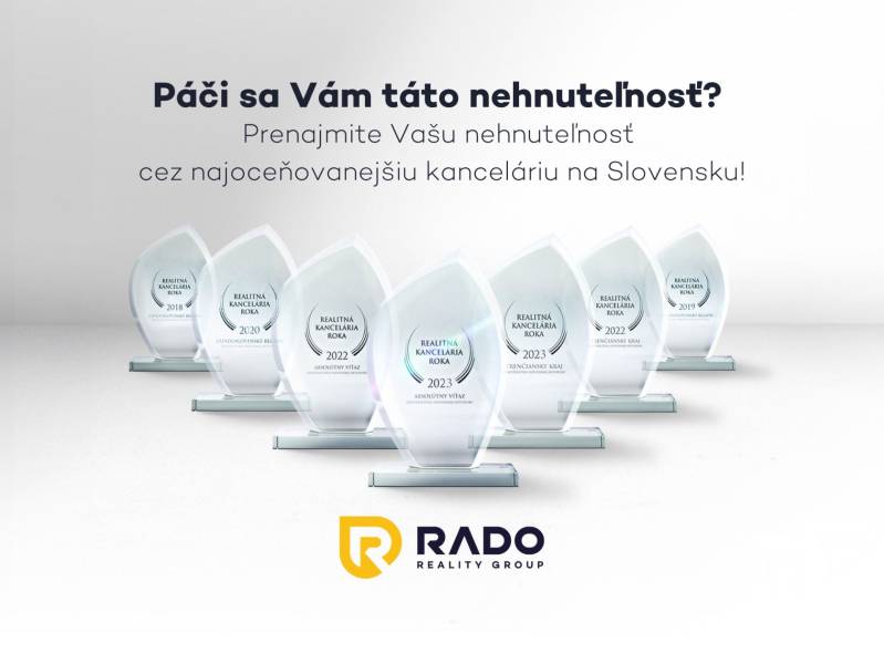 The photograph shows the awards of the real estate agency RADO Reality Group.