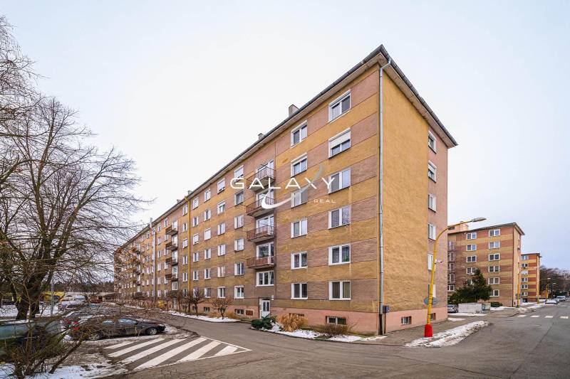 Low-rise apartment buildings in Fiľakovo, suitable for a 2-room apartment, snow-covered streets.