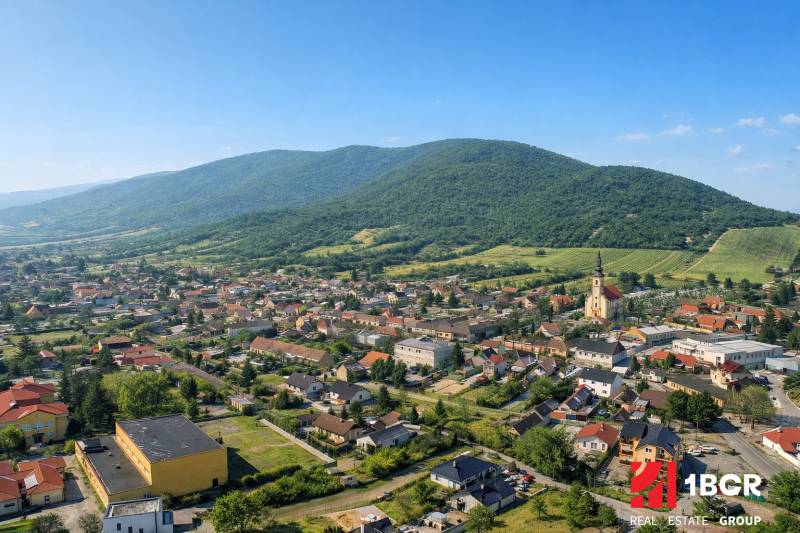 Aerial view of Horné Orešany, visible architecture and surrounding landscape. Plots - housing.
