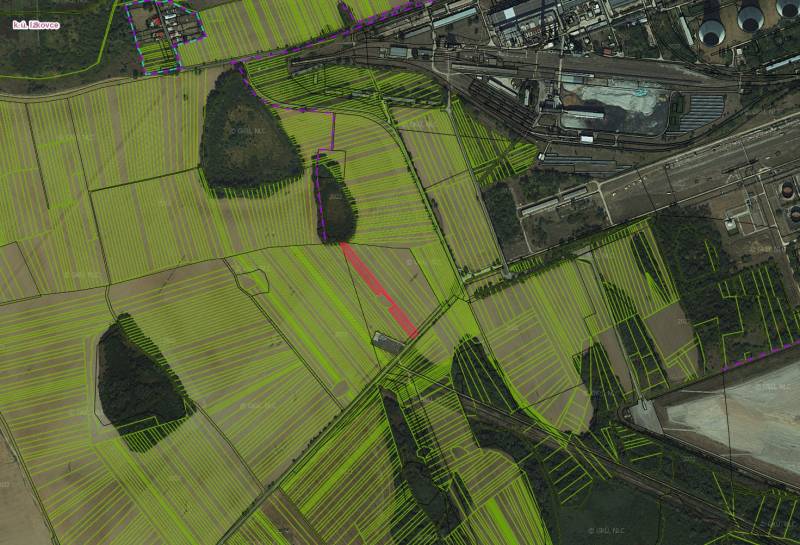 Aerial view of agricultural and forest land around Ižkovce.