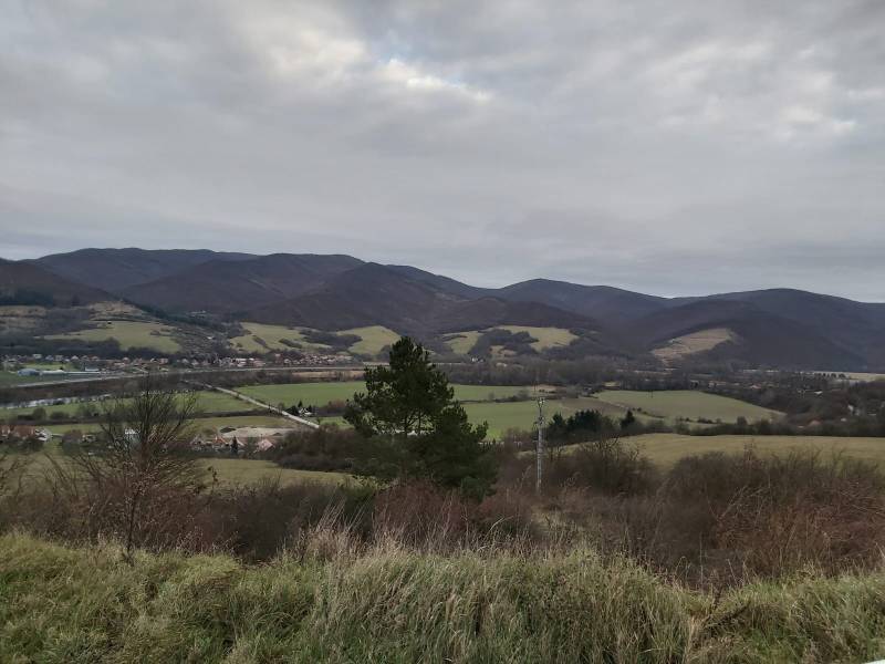 A view from nature near Orovnica with a view of the mountains and a village in the distance.